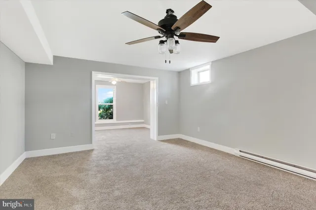 a bathroom with a sink a toilet and bathtub
