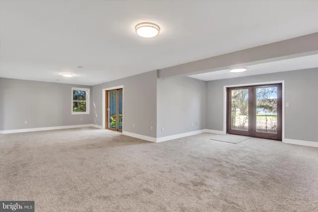 a view of a workspace with furniture and a potted plant