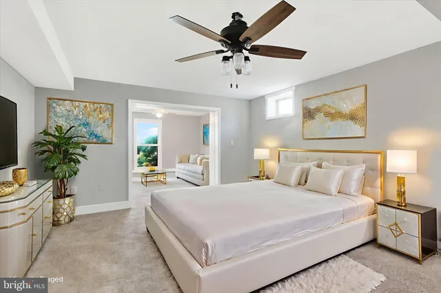 a view of an empty room with a ceiling fan