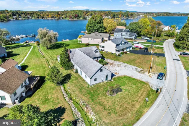 an aerial view of residential houses with outdoor space