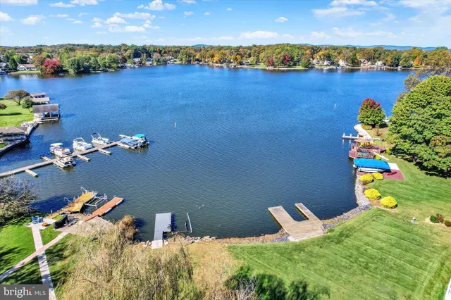 a view of a terrace with furniture and a floor to ceiling window