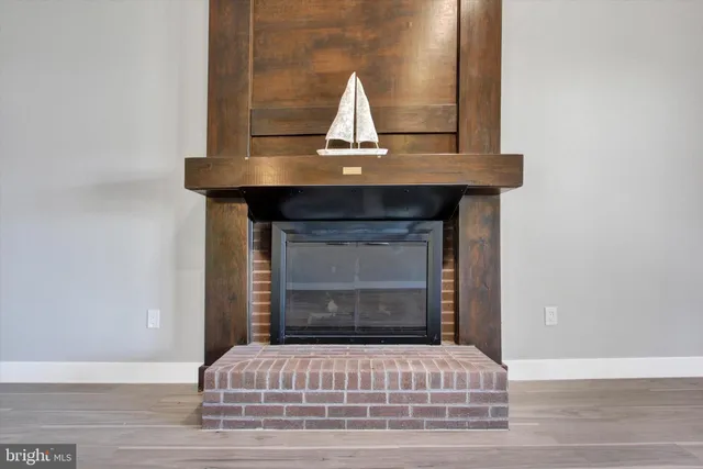 a room with wooden floor and window