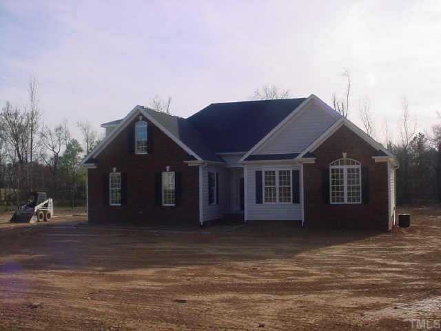 265 Fletcher Ridge Road Timberlake, NC 27583 - Photo 1 of 1 a house view with a garden space