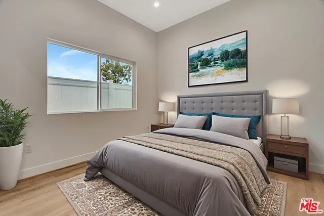 a bathroom with a sink vanity granite shower and a mirror