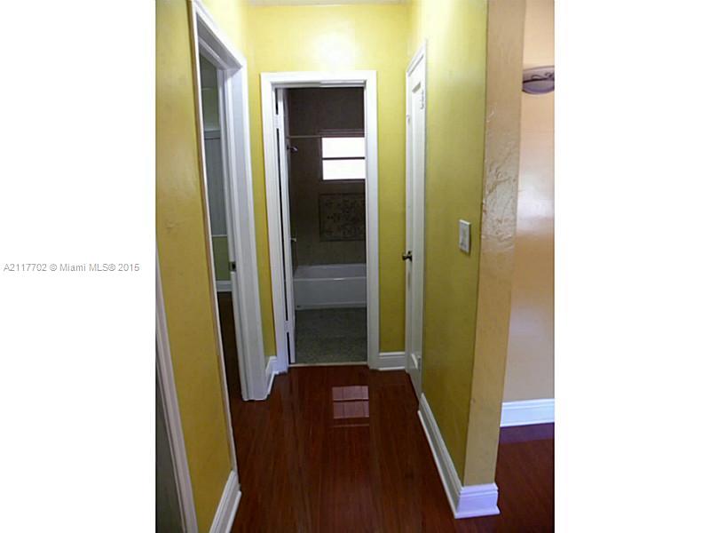 6180 Southwest 11th Street West Miami, FL 33144 - Photo 12 of 20 a view of a hallway with wooden floor
