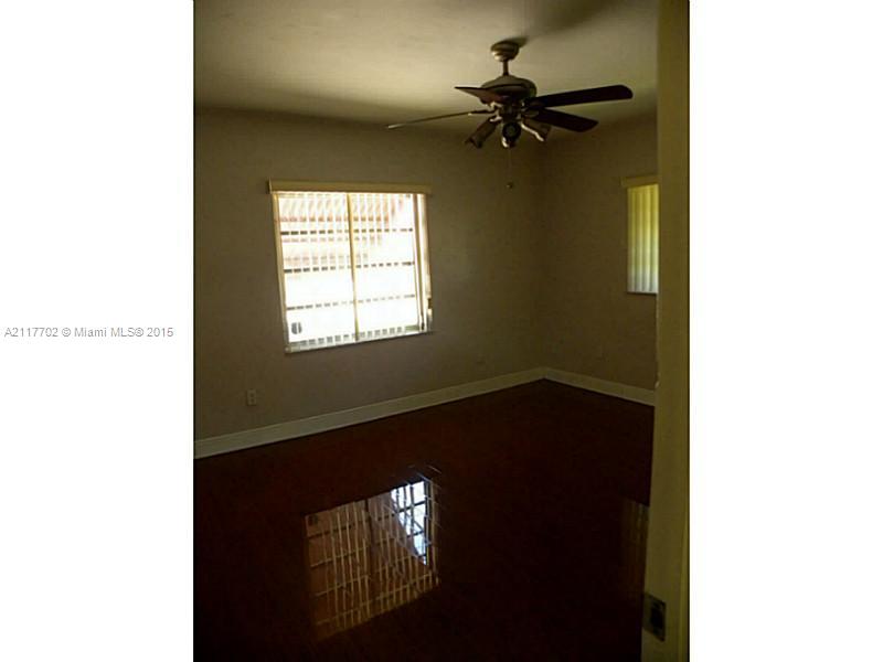6180 Southwest 11th Street West Miami, FL 33144 - Photo 13 of 20 a picture of a hallway with a window