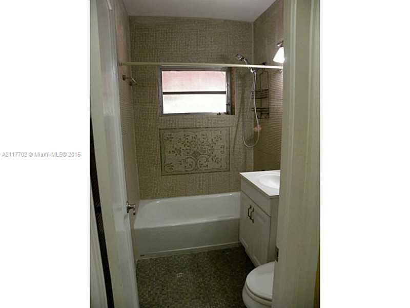 6180 Southwest 11th Street West Miami, FL 33144 - Photo 15 of 20 a bathroom with a sink and toilet