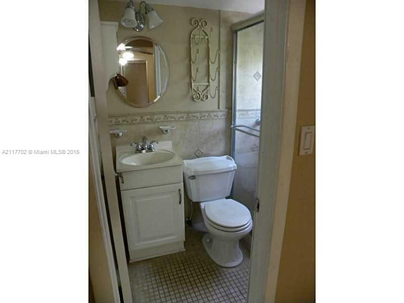 6180 Southwest 11th Street West Miami, FL 33144 - Photo 17 of 20 a bathroom with a sink and a toilet