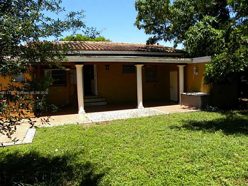 6180 Southwest 11th Street West Miami, FL 33144 - Photo 2 of 20 a front view of a house with a garden