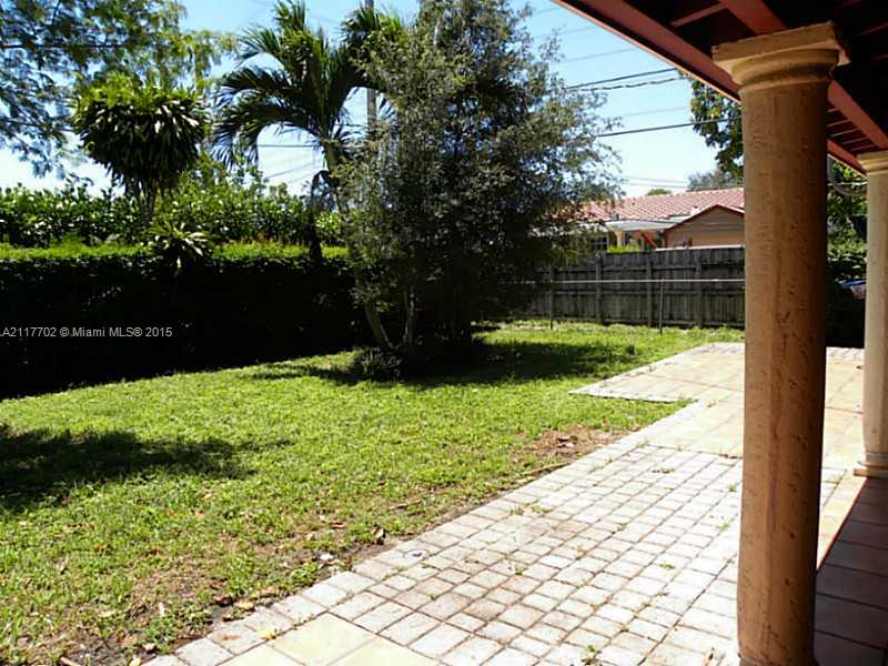 6180 Southwest 11th Street West Miami, FL 33144 - Photo 3 of 20 a view of backyard with green space