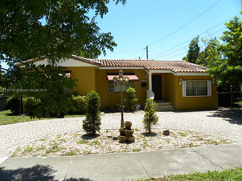 6180 Southwest 11th Street West Miami, FL 33144 - Photo 7 of 20 a view of a house with snow on the road