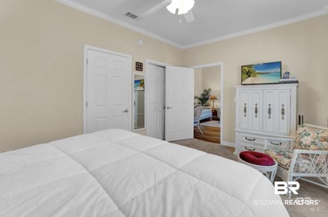 430 West Fort Morgan Road Gulf Shores, AL 36542 - Photo 14 of 27 Bedroom with neutral-toned walls, crown molding, and a ceiling fan