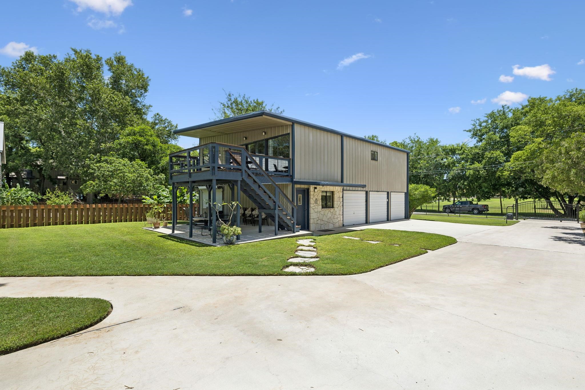 1435 East Zipp Road New Braunfels, TX 78130 - Photo 14 of 43 a front view of a house with a yard and garage