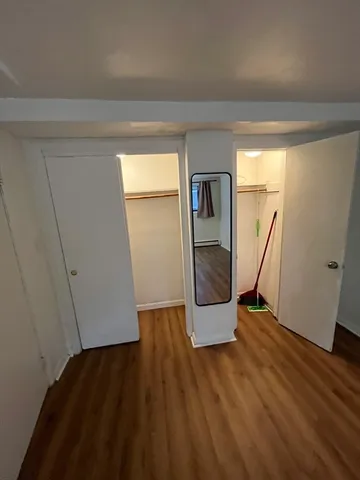 a view of entryway with wooden floor and stairs