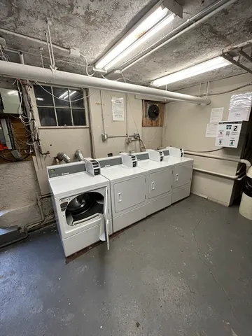 a utility room with cabinets