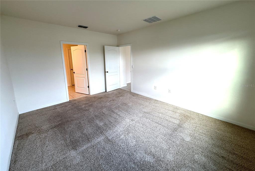 2877 Sunridge Loop St. Cloud, FL 34771 - Photo 6 of 19 a view of empty room