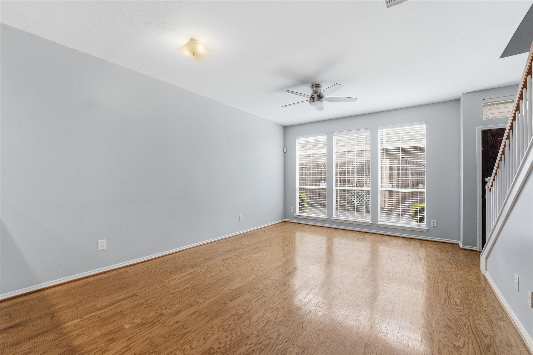 1507 Sutton Street Houston, TX 77006 - Photo 5 of 31 wooden floor in an empty room with a window