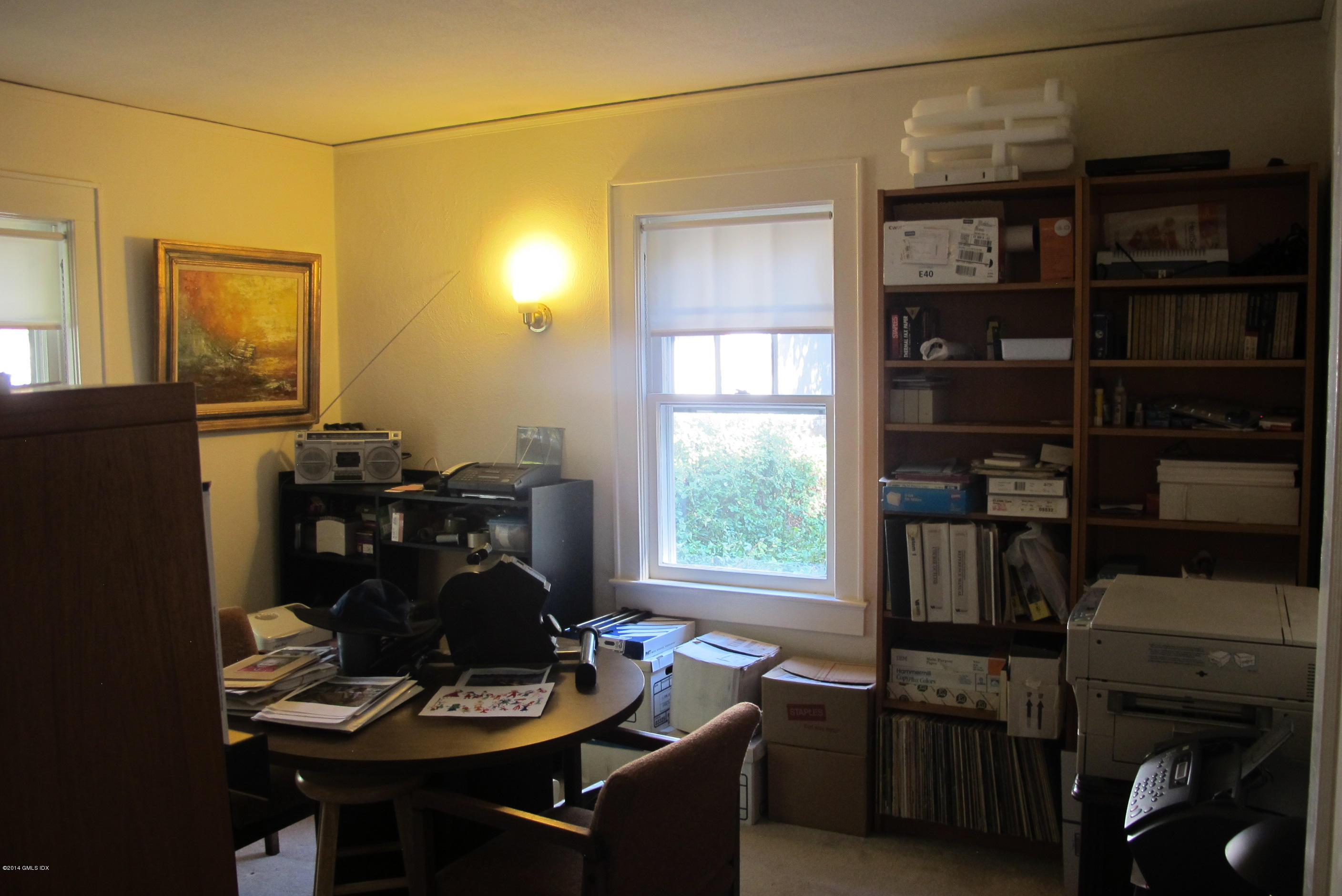 29 Butler Street Cos Cob, CT 06807 - Photo 17 of 24 a table and chairs in a room next to a window