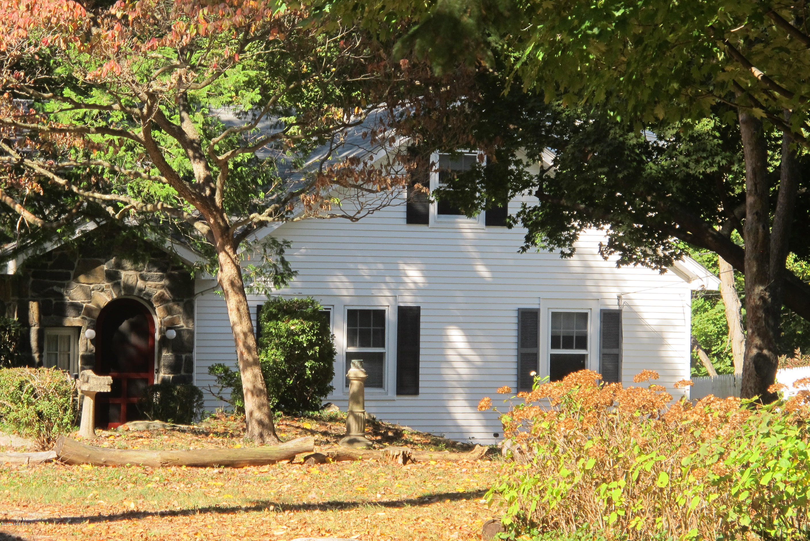 29 Butler Street Cos Cob, CT 06807 - Photo 23 of 24 a front view of house with yard