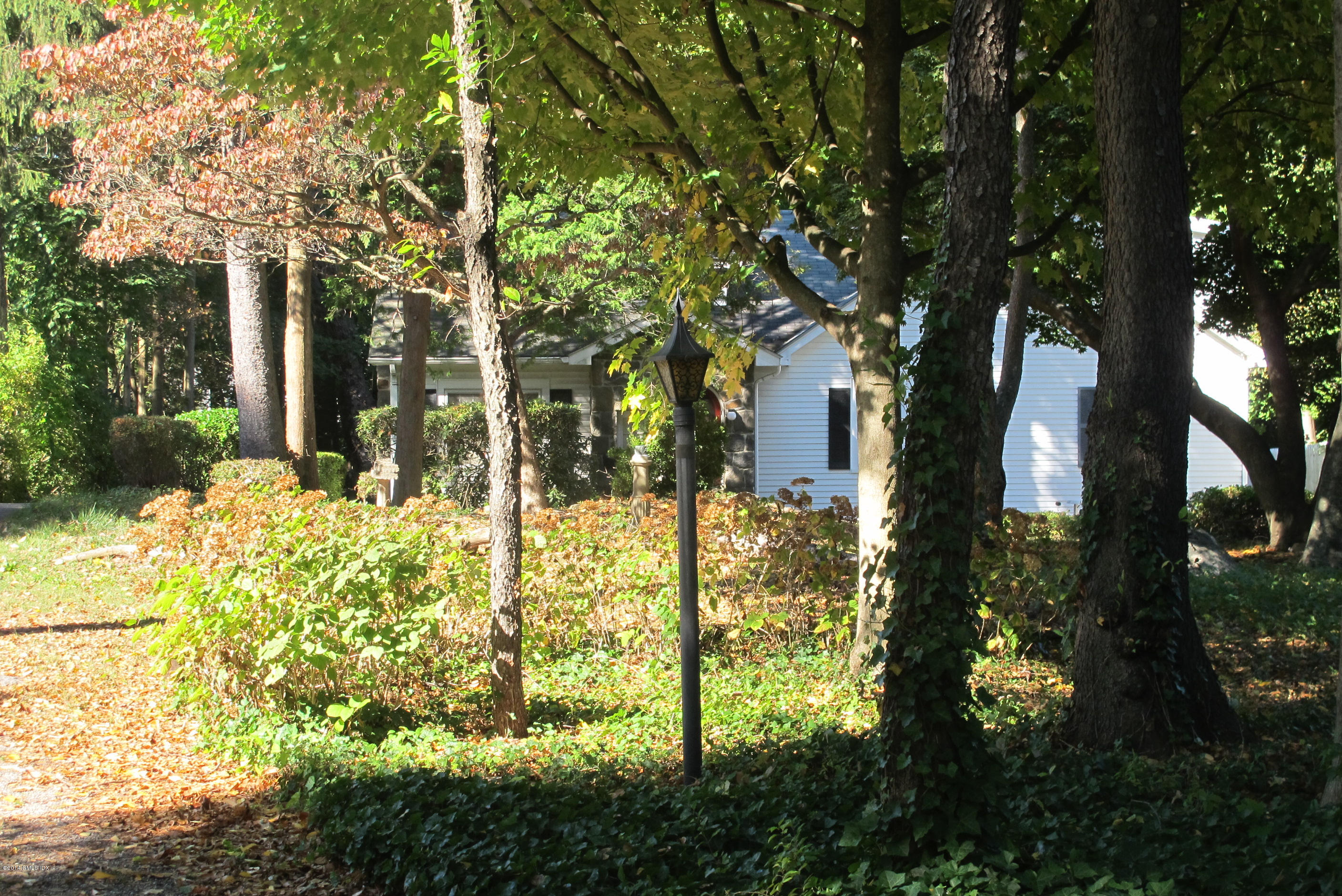 29 Butler Street Cos Cob, CT 06807 - Photo 4 of 24 a backyard of a house with lots of green space