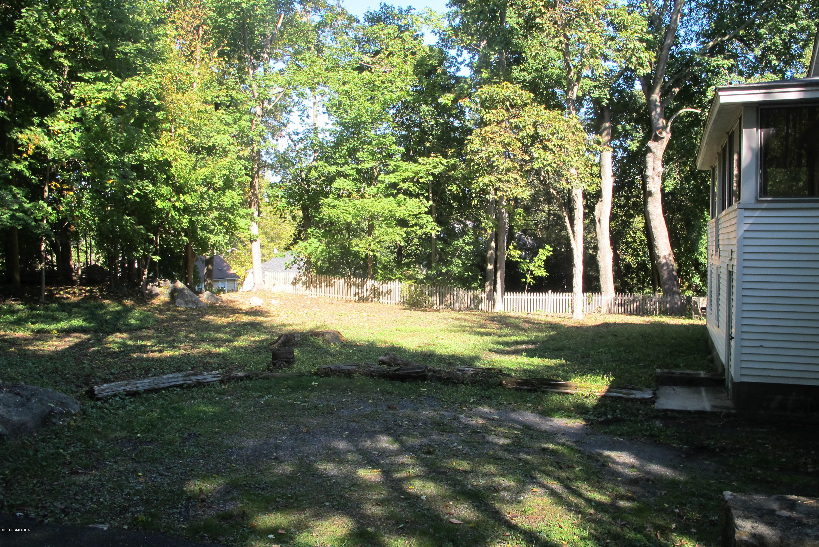 29 Butler Street Cos Cob, CT 06807 - Photo 9 of 24 a view of yard with tree