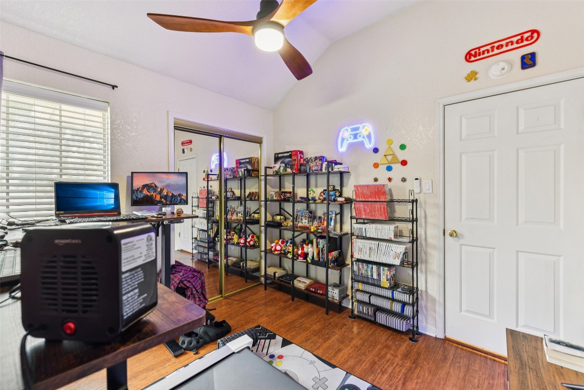 5318 West Ridge Boulevard Temple, TX 76502 - Photo 12 of 27 Home office with dark wood-type flooring, ceiling fan, and lofted ceiling