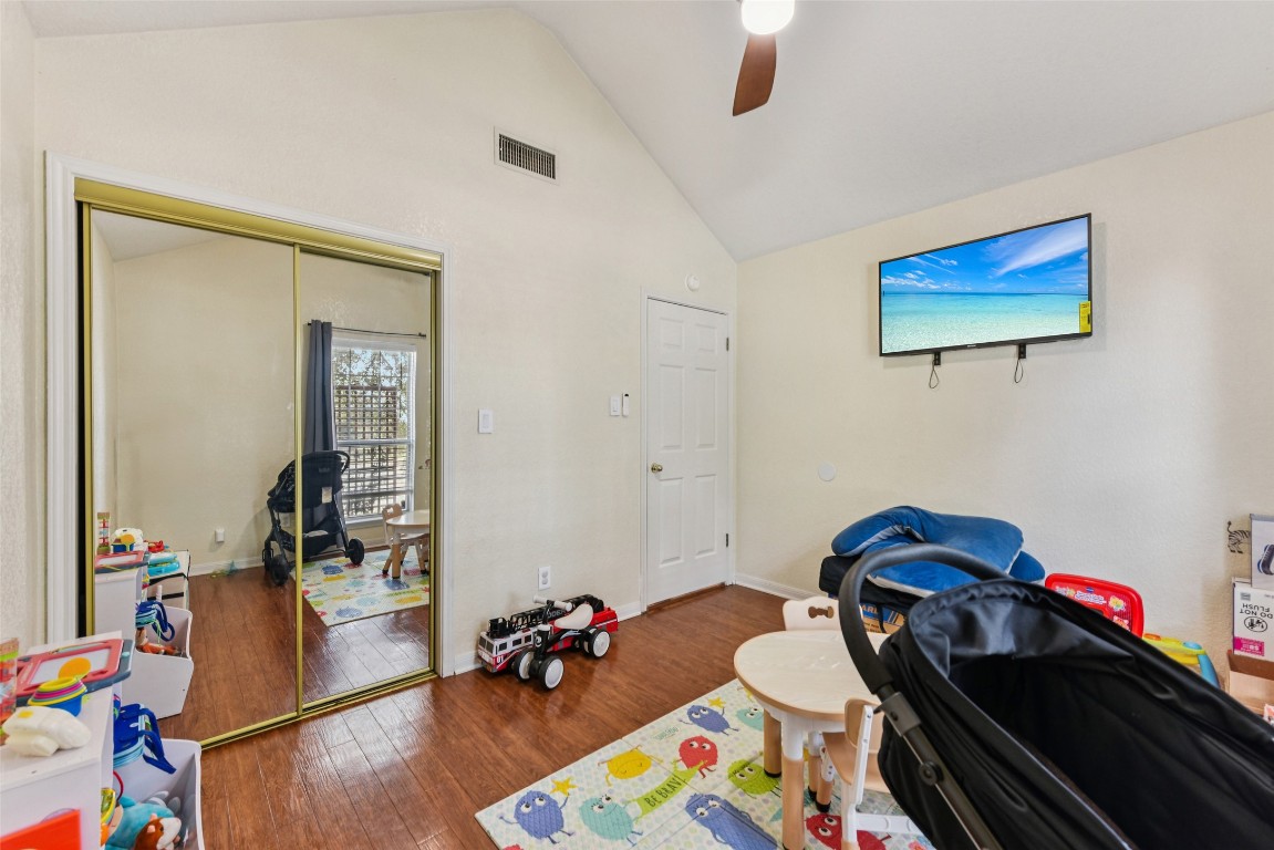 5318 West Ridge Boulevard Temple, TX 76502 - Photo 14 of 27 Game room featuring wood finished floors, ceiling fan, and high vaulted ceiling