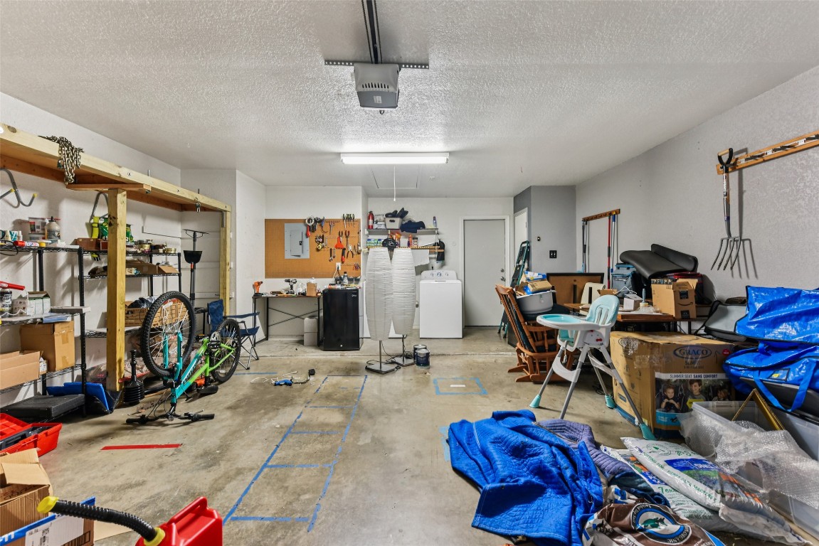 5318 West Ridge Boulevard Temple, TX 76502 - Photo 24 of 27 Garage featuring washer / dryer and a garage door opener