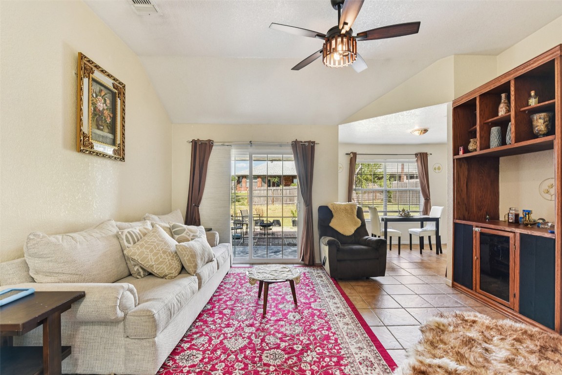 5318 West Ridge Boulevard Temple, TX 76502 - Photo 3 of 27 Living room with lofted ceiling, light tile patterned floors, and ceiling fan