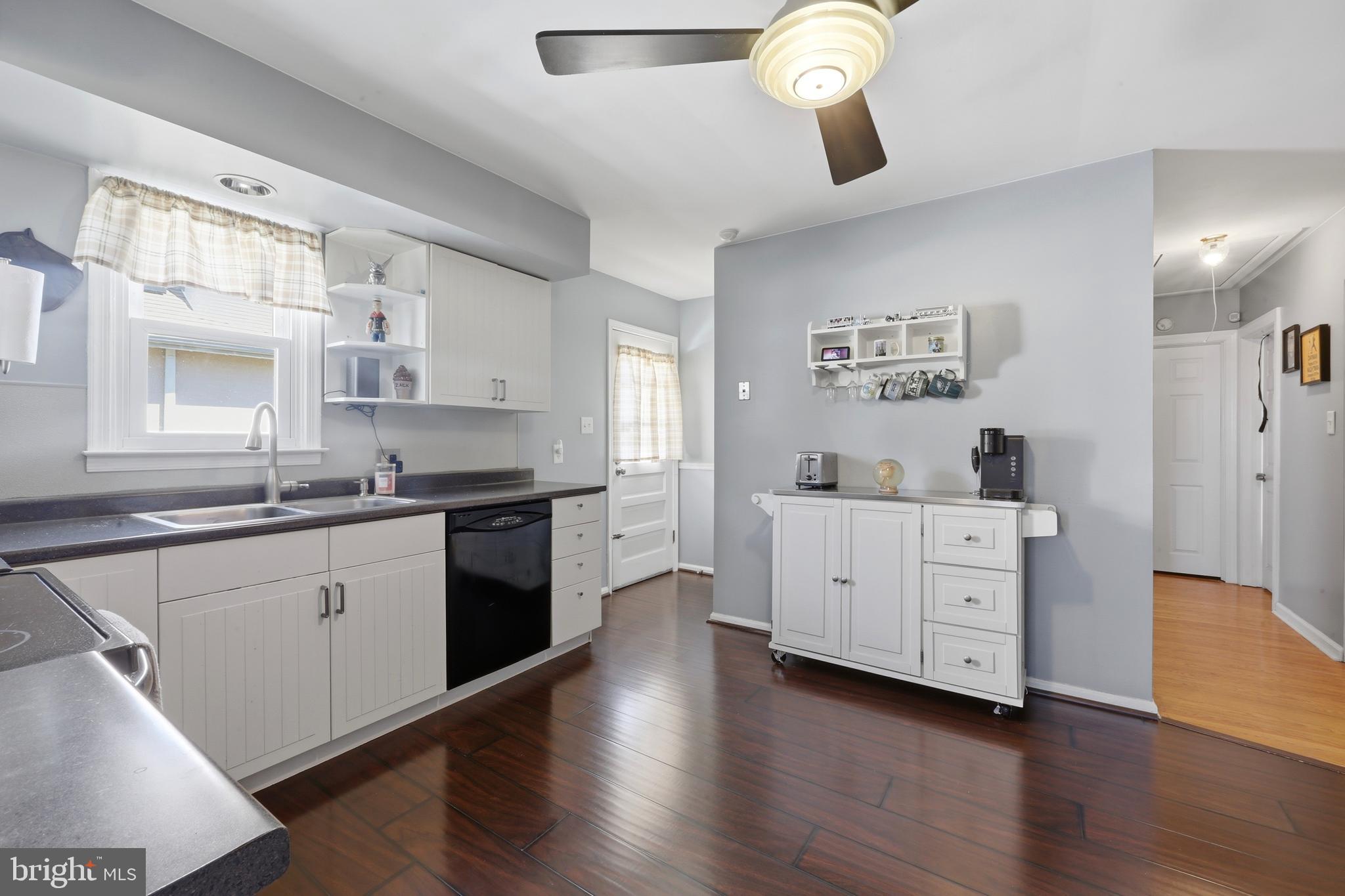 129 Maple Avenue Brookhaven, PA 19015 - Photo 1 of 16 a large white kitchen with cabinets