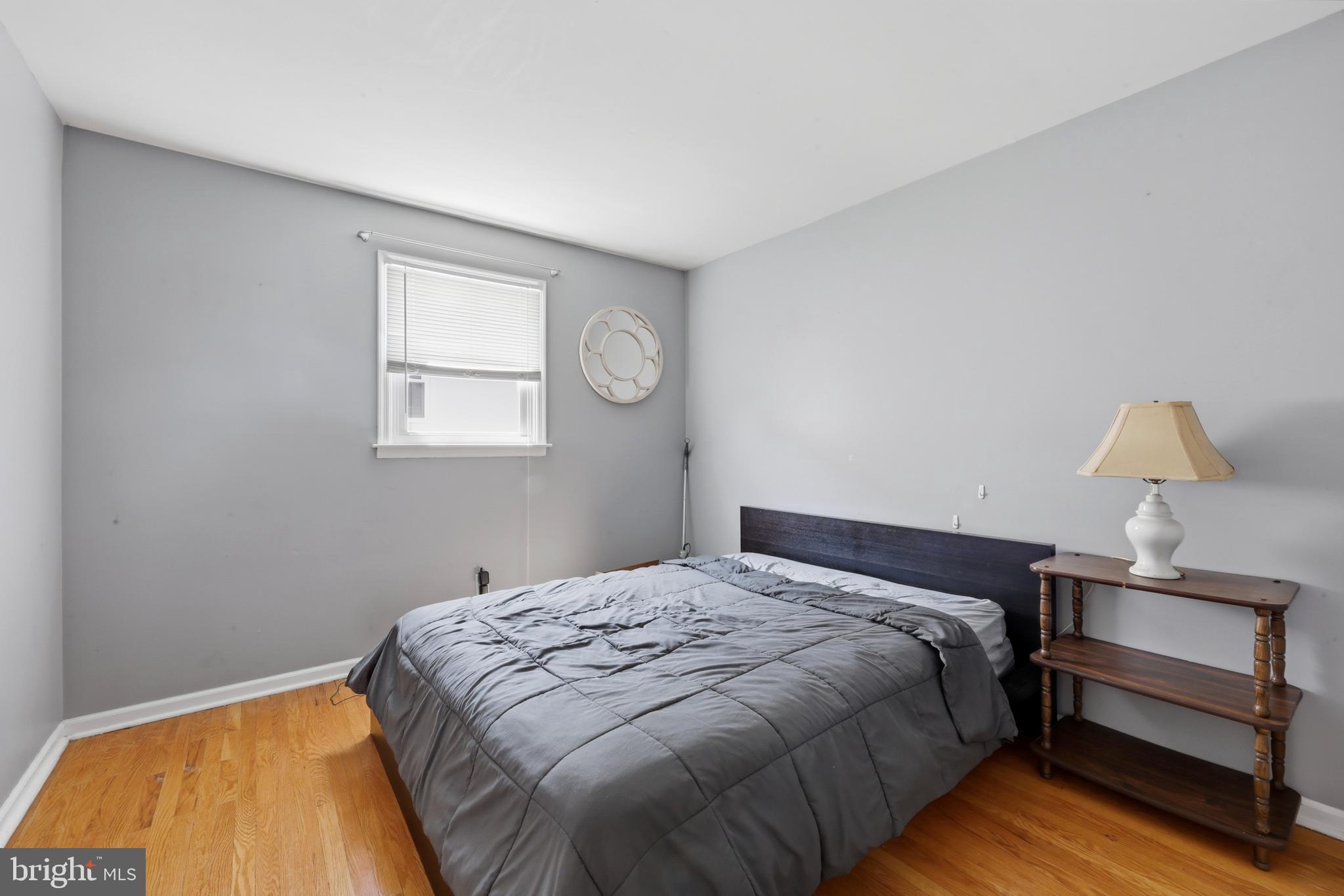 129 Maple Avenue Brookhaven, PA 19015 - Photo 12 of 16 a bedroom with a bed and a window