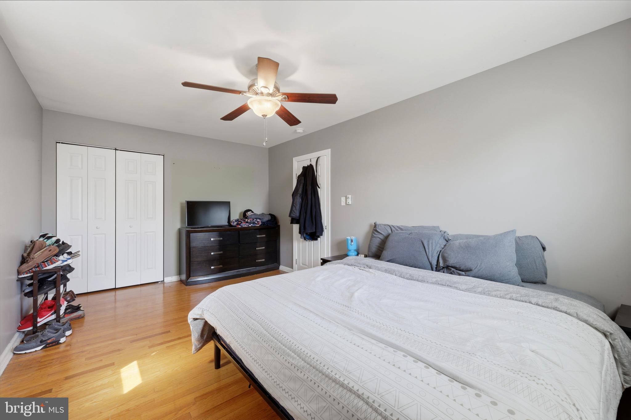 129 Maple Avenue Brookhaven, PA 19015 - Photo 10 of 16 a bedroom with a bed and a flat tv screen on a dresser
