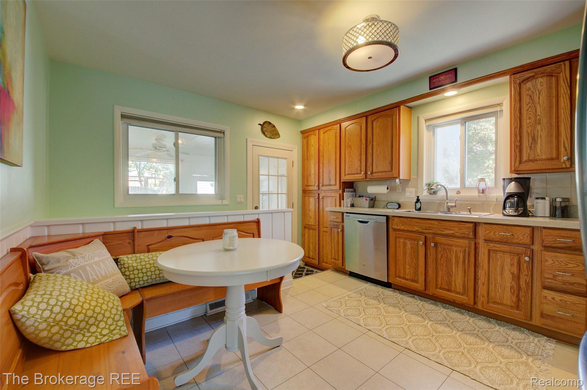 340 Thalia Avenue Rochester, MI 48307 - Photo 16 of 49 Spacious kitchen with breakfast nook...….kitchen table and bench stay with the home as it's a perfect fit!
