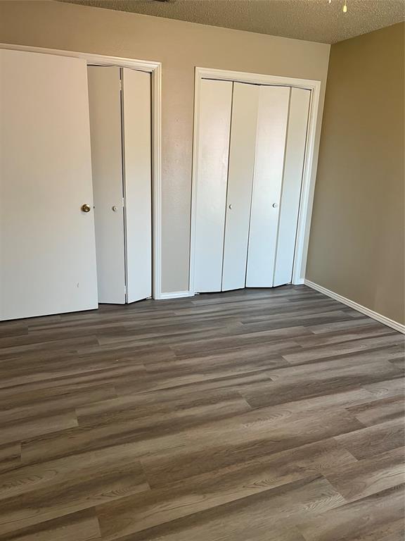 2234 Irwin Street Fort Worth, TX 76110 - Photo 11 of 17 a view of wooden floor