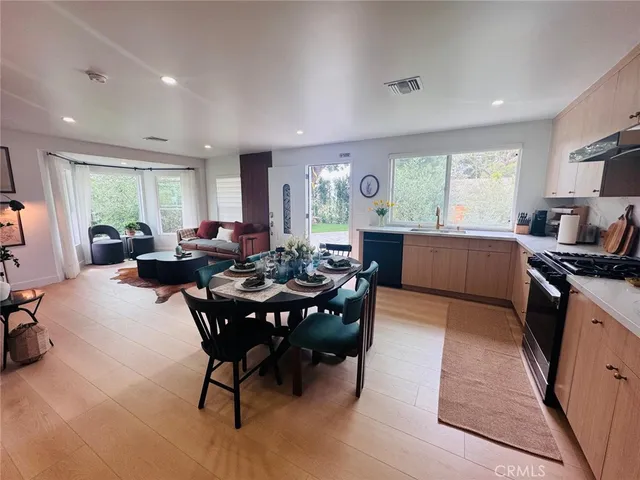 a bathroom with a sink vanity and toilet