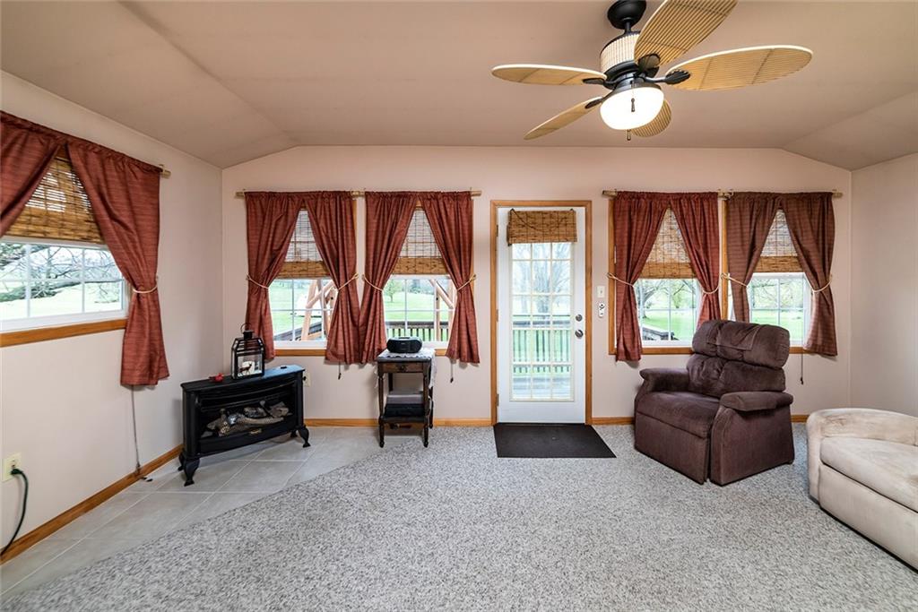 180 Holly Place Road Mount Pleasant, PA 15666 - Photo 11 of 23 FAMILY ROOM WITH ACCESS TO DECK OVERLOOKING ~2.2 ACRES AND FAIRWAY #10 OF THE NORVELT GOLF CLUB