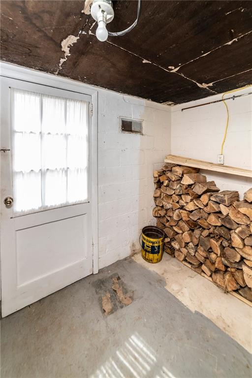 180 Holly Place Road Mount Pleasant, PA 15666 - Photo 20 of 23 LOWER LEVEL STORAGE AREA ADJACENT TO LAUNDRY ROOM WITH WALK-UP TO BACKYARD.