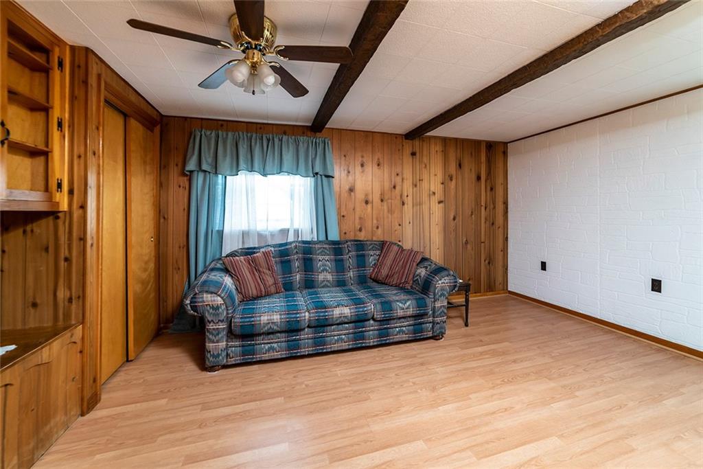 180 Holly Place Road Mount Pleasant, PA 15666 - Photo 3 of 23 DEN WITH BUILT-INS OF KNOTTY PINE.