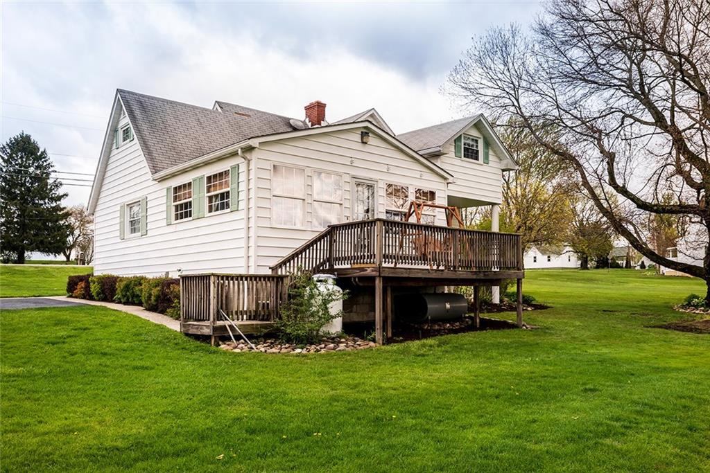 180 Holly Place Road Mount Pleasant, PA 15666 - Photo 23 of 23 EXTERIOR REAR WITH ACCESS TO DECK AND FAMILY ROOM.