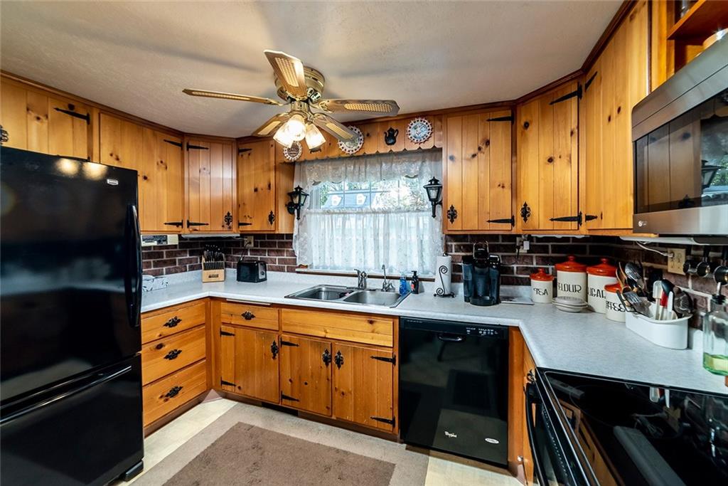 180 Holly Place Road Mount Pleasant, PA 15666 - Photo 6 of 23 KITCHEN WITH ORIGINAL CUSTOM KNOTTY PINE CABINETRY.