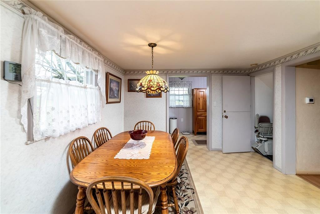 180 Holly Place Road Mount Pleasant, PA 15666 - Photo 8 of 23 KITCHEN DINING AREA WITH ACCESS TO HALF BATH, 6X6 STORAGE/OFFICE AREA, & STAIRS TO FINISHED LOWER LEVEL.