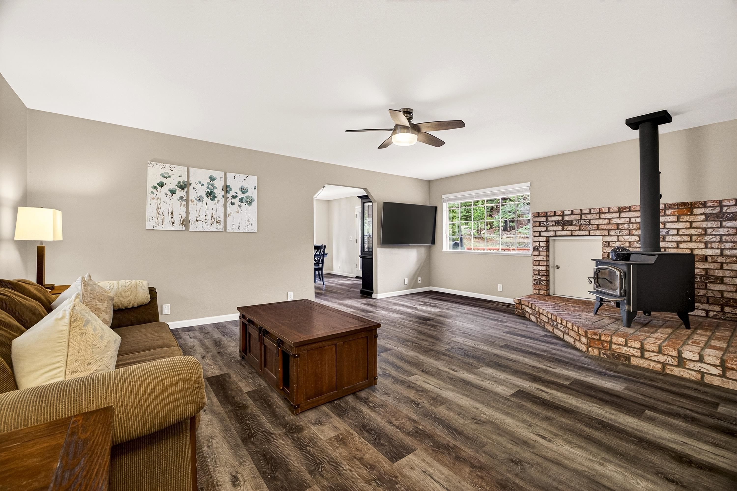 811 Golf Club Road Lake Almanor, CA 96137 - Photo 8 of 42 a living room with furniture and a flat screen tv