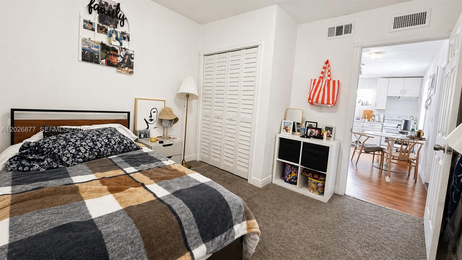 2727 Southwest 24th Street Miami, FL 33145 - Photo 16 of 18 a bedroom with a bed and dresser