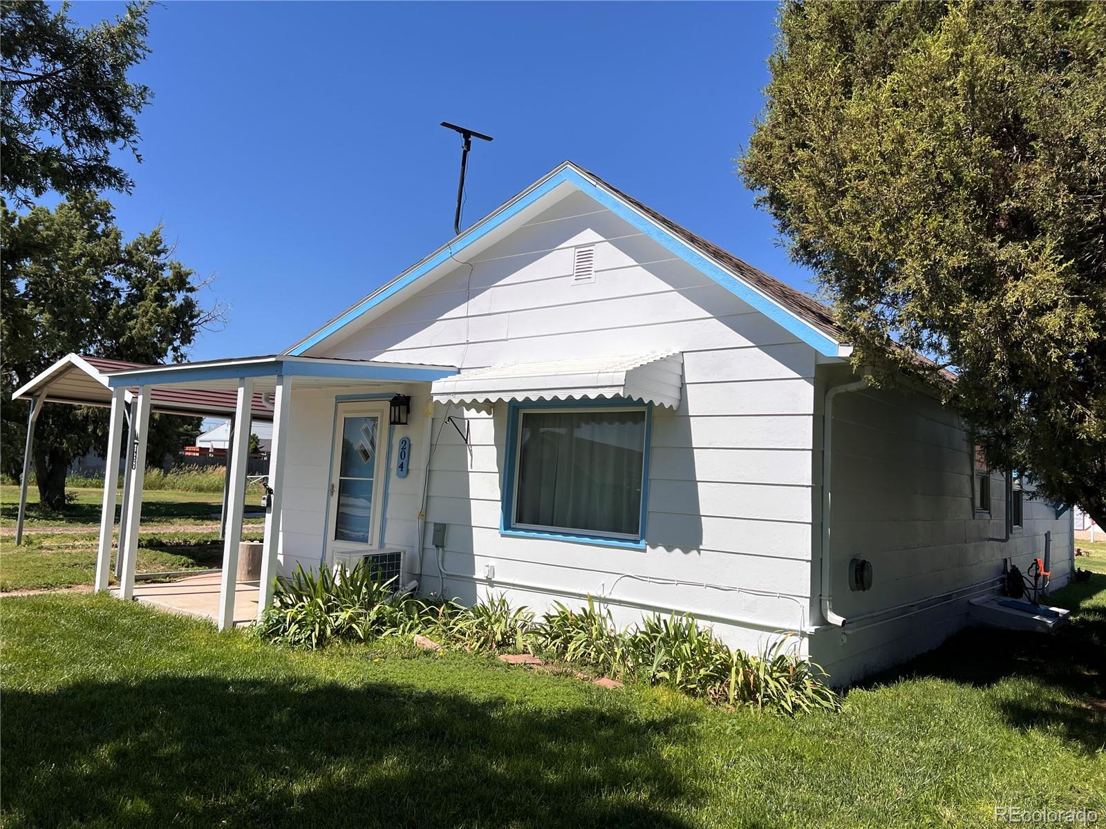 204 Main Street Genoa, CO 80818 - Photo 20 of 25 a view of a house with garden