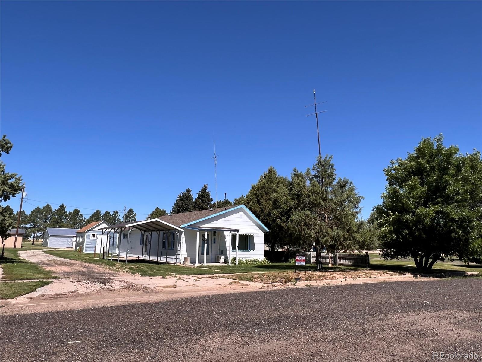 204 Main Street Genoa, CO 80818 - Photo 25 of 25 a front view of a house with a yard