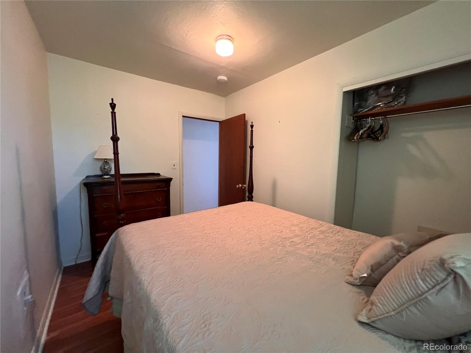 204 Main Street Genoa, CO 80818 - Photo 10 of 25 a bedroom with a bed and a desk