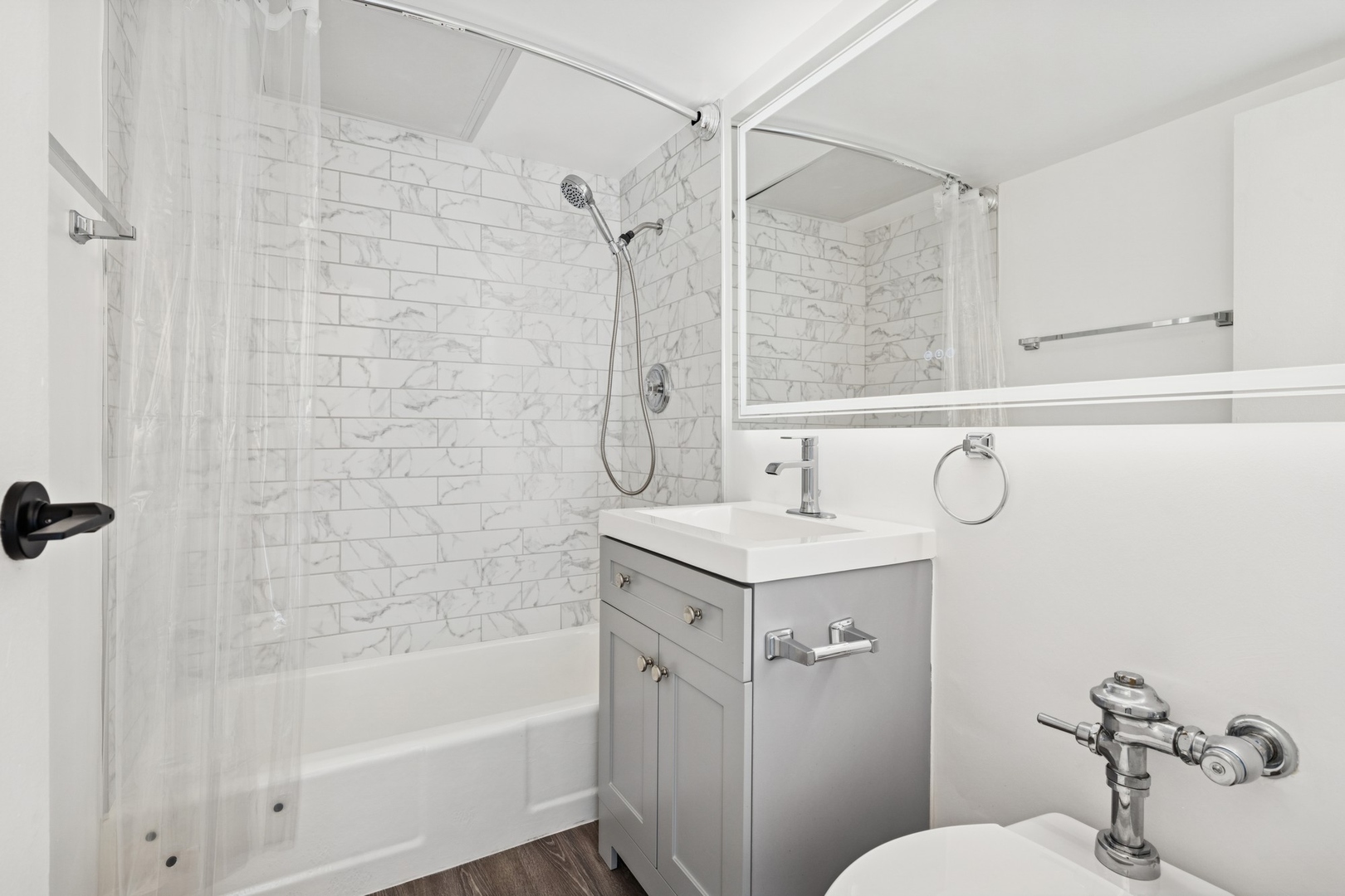 253 East Delaware Place, Unit 4D Chicago, IL 60611 - Photo 11 of 14 a bathroom with a sink a toilet and shower