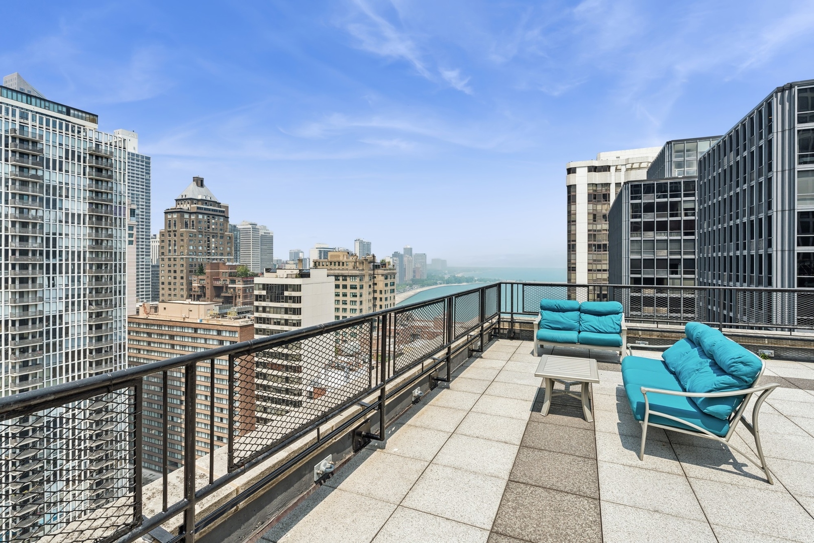 253 East Delaware Place, Unit 4D Chicago, IL 60611 - Photo 14 of 14 a view of balcony with couch