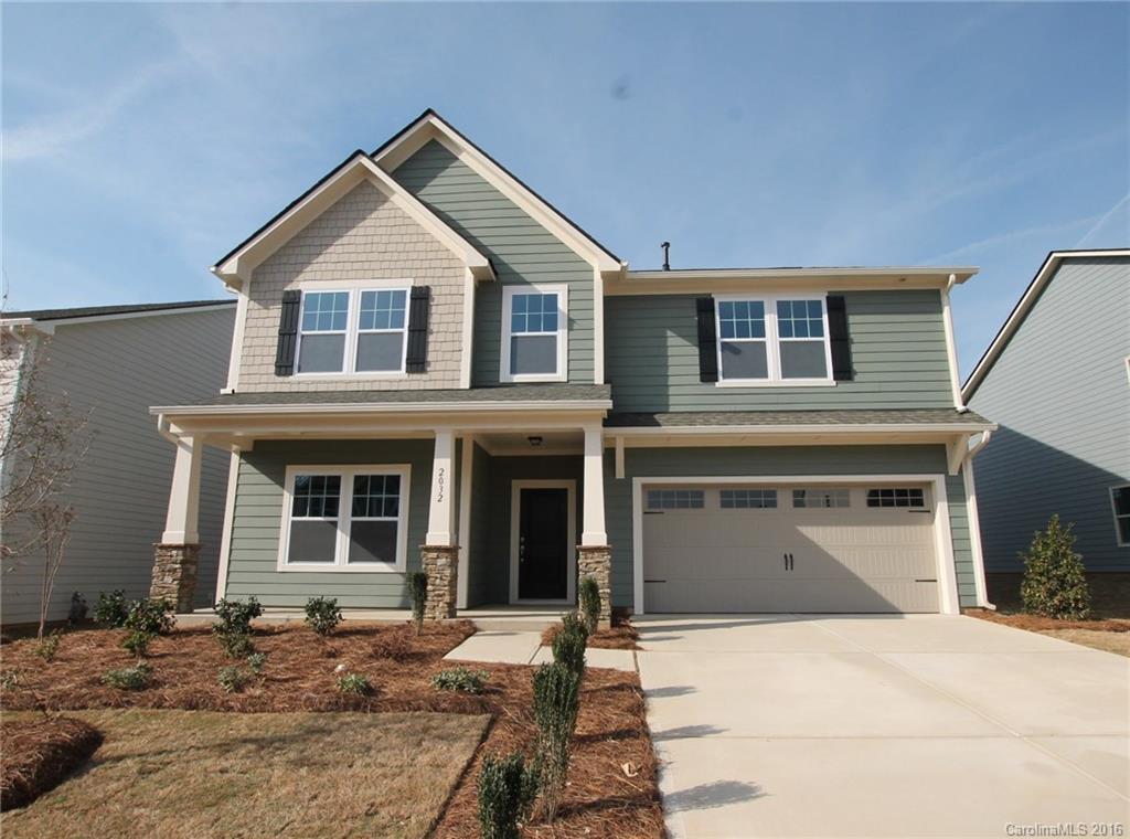 2032 Fuschia Court, Unit 136 Fort Mill, SC 29708 - Photo 1 of 22 a front view of a house with a yard