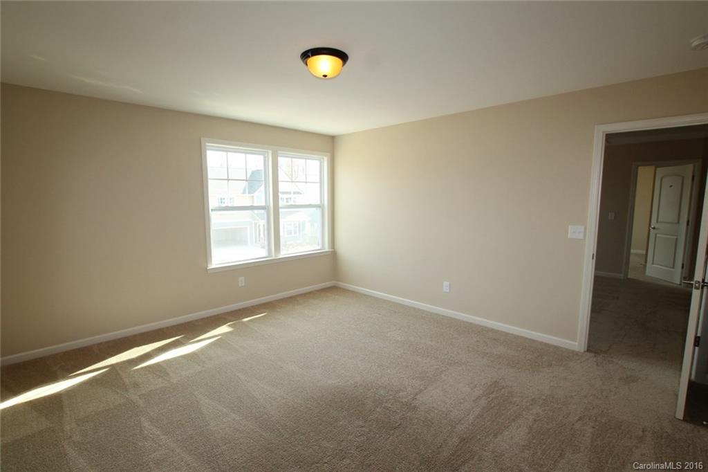 2032 Fuschia Court, Unit 136 Fort Mill, SC 29708 - Photo 16 of 22 an empty room with windows and closet